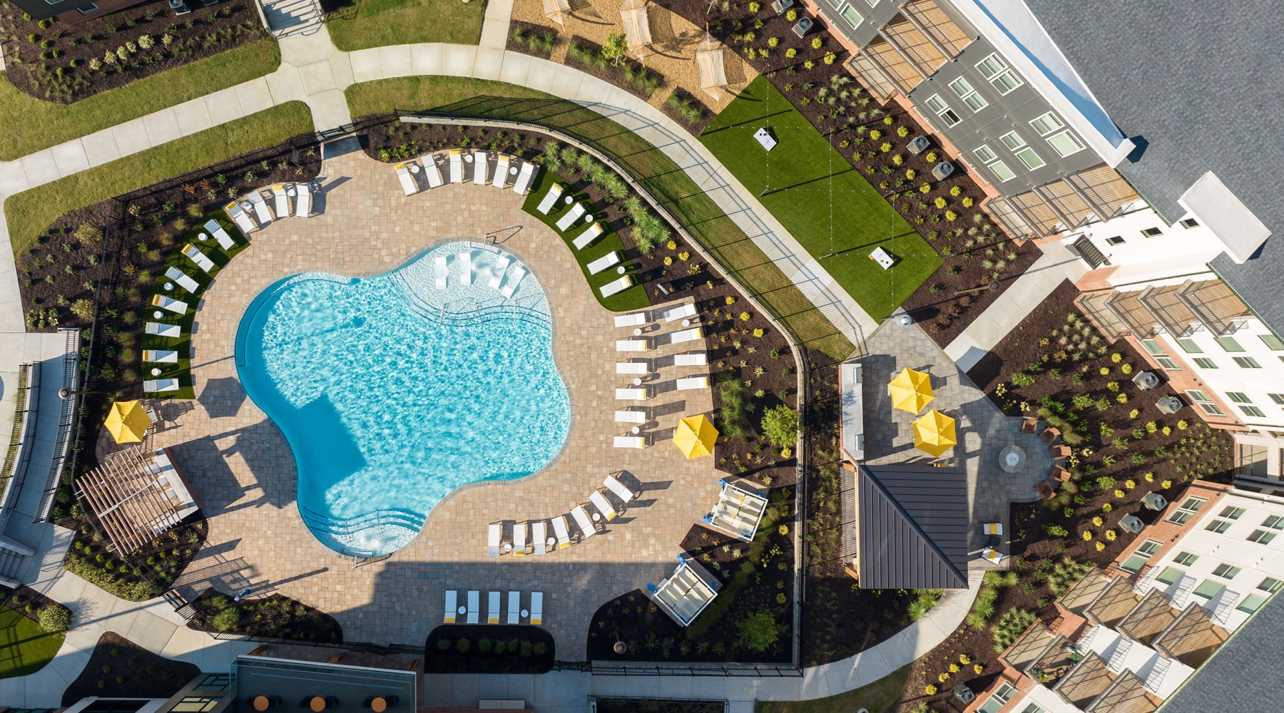 aerial view of the outdoor pool and community spaces at the Aventon Nora apartment community in Raleigh, NC